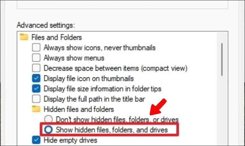 Nhấp vào tab View. Dưới mục Advanced settings hãy chọn Show hidden files, folders, and drives để ẩn ổ đĩa Win 11